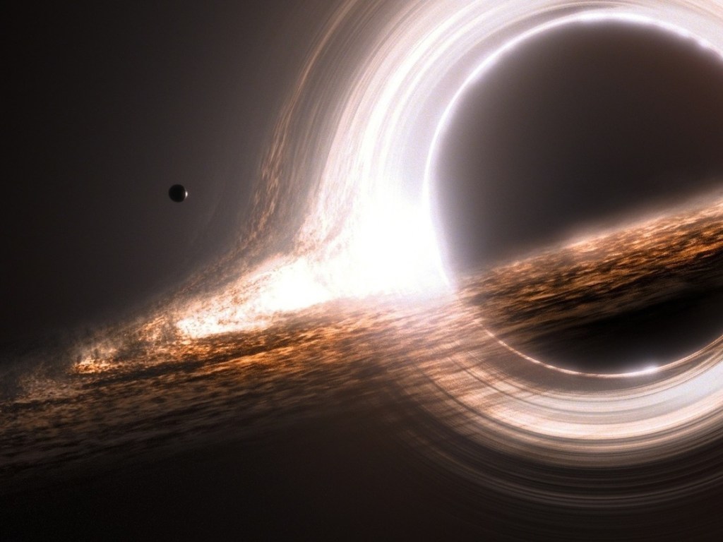 Астрофизики в замешательстве: неопознанное тело подпитывает черную дыру